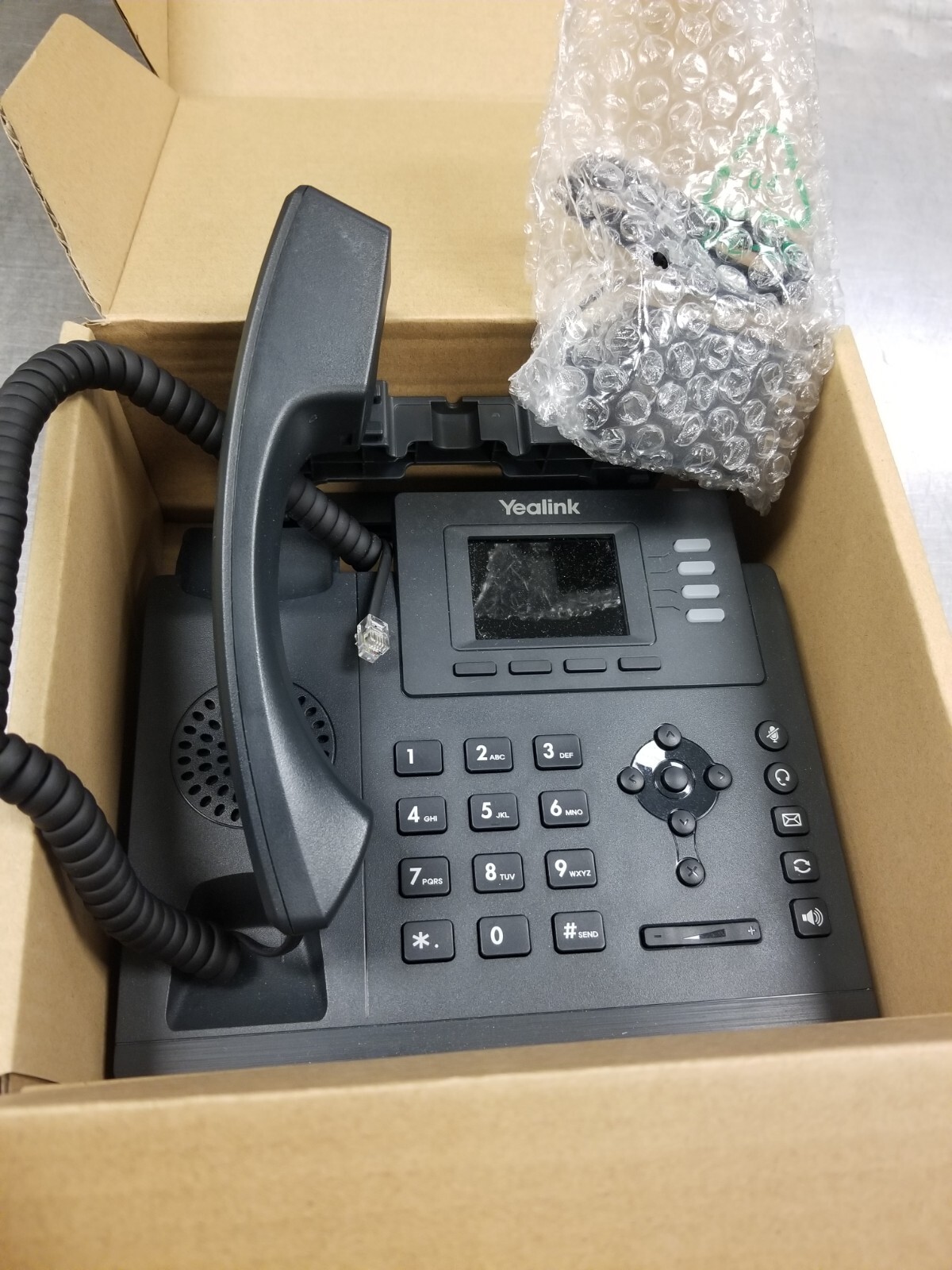 One Yealink SIP-T33G IP Phone, 2.4-Inch Color Display. Dual-Port NIB